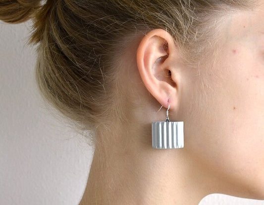 Silver RULLO:  Earrings made of corrugated cardboard
