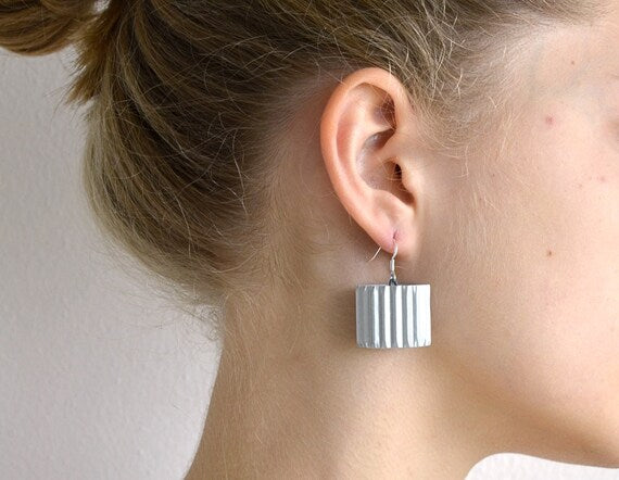 Silver RULLO:  Earrings made of corrugated cardboard